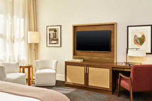 a hotel room with a television and a bed at Palace Hotel, a Luxury Collection Hotel, San Francisco in San Francisco