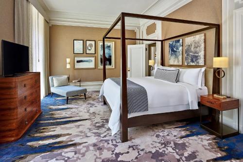 a bedroom with a large bed and a television at Palace Hotel, a Luxury Collection Hotel, San Francisco in San Francisco