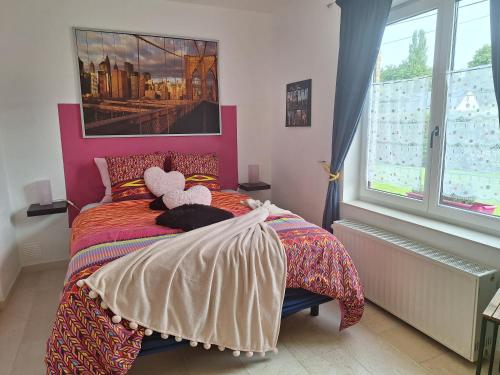 Postel nebo postele na pokoji v ubytování Le Broctia Rose
