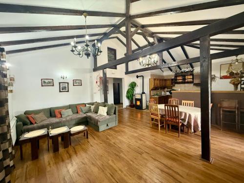 a living room with a couch and a table at House Milovanovic in Soko Banja