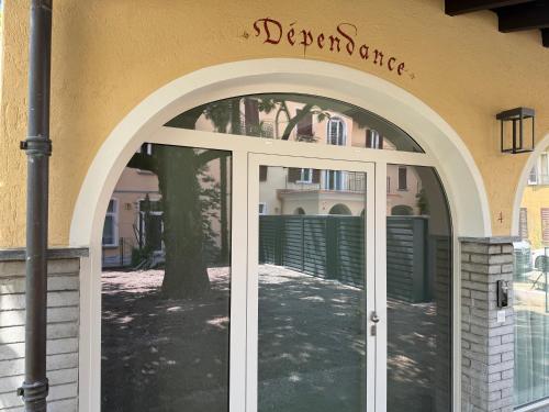 an entrance to a building with an arch doorway at Schloss Locarno - Self Check-In in Locarno