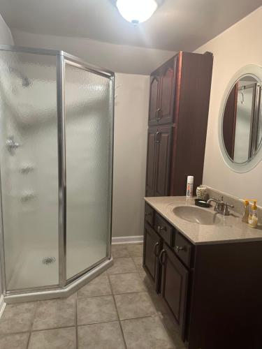 a bathroom with a shower and a sink at The Russenberger Retreat in Little Rock