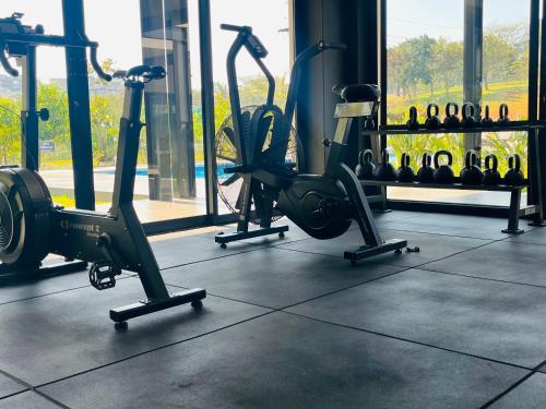 a gym with several exercise bikes in a room at Ballito Village 157 in Ballito