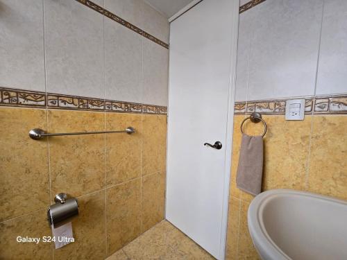 a bathroom with a shower with a tub and a sink at Amplio apartamento sobre Avenida Viaducto in Mexico City
