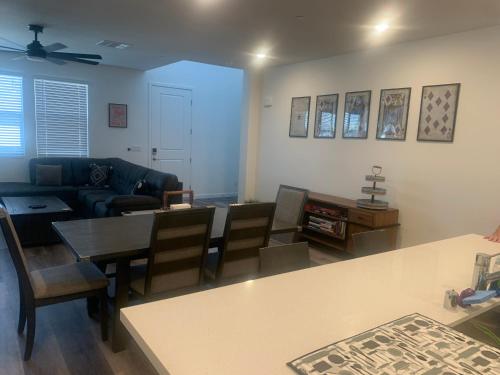 a living room with a couch and a table at Walking on Water Street in Las Vegas