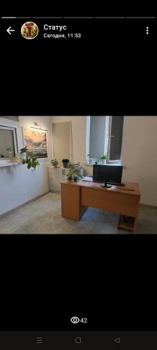 a office with a desk with a laptop on it at Aerodrom Hotel in Almaty