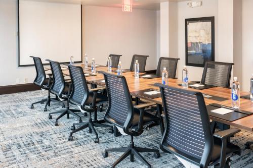 a conference room with a long table and chairs at Crowne Plaza Kansas City Downtown by IHG in Kansas City