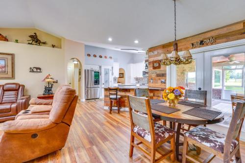 a living room with a table and a couch at Welcoming Home with Yard on 20 Acres in High Springs in High Springs