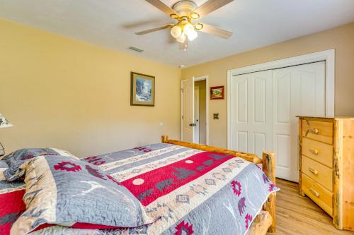 a bedroom with a bed and a ceiling fan at Welcoming Home with Yard on 20 Acres in High Springs in High Springs