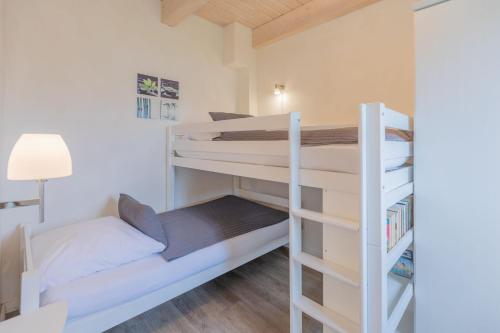 Ένα ή περισσότερα κρεβάτια σε δωμάτιο στο Ferienhaus Lachmöwe