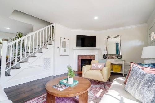 a living room with a couch and a table at Dilworth Dream Cottage in Charlotte