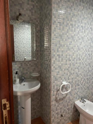 a bathroom with a sink and a mirror at Coastal Apartment in Cabo in Cabo Negro