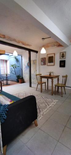 a living room with a couch and a table at Casa cuatro in Oaxaca City