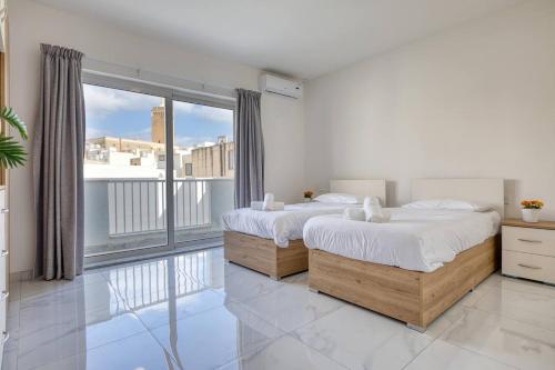 Modern Apartments W Balcony - Valletta Viewsにあるベッド