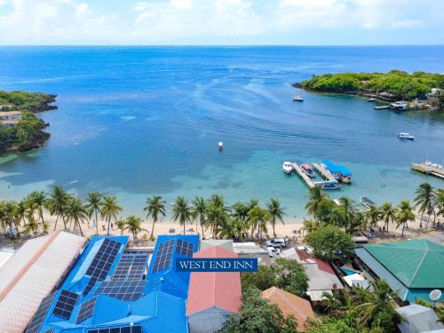 a view of the west end of the west end inn with a beach at Penthouse Beachfront Luxury Bay View - West End in Roatan