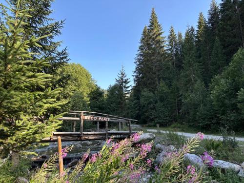 a wooden bridge with a sign that reads forest ride at Beco's Place in Plav