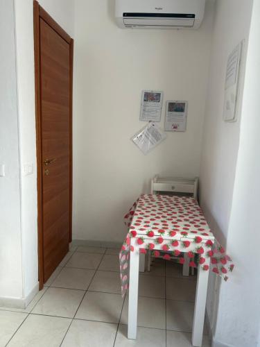 a table with a table cloth on it in a room at Casa della Rosa in La Spezia