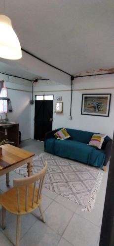 a living room with a couch and a table at Casa cuatro in Oaxaca City