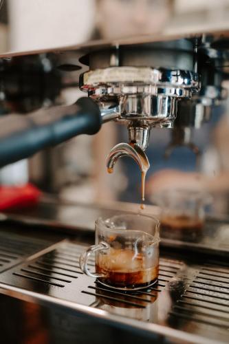 a cup of coffee is being brewed at Hotel Bayit in Salida