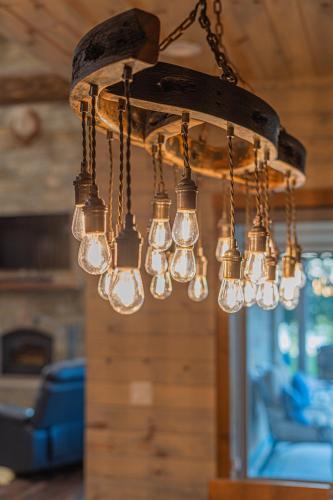 a chandelier made out of old light bulbs at Stunning Eufaula Waterfront Home in Dixie Cove 