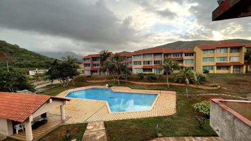 Bazén v ubytování Escapada frente al mar nebo v jeho okolí