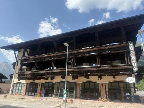 a large building with a lot of windows at Andys Enzian in Leutasch