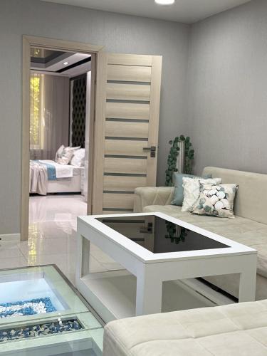 a living room with a couch and a table at Laylak House in Salor Bekati