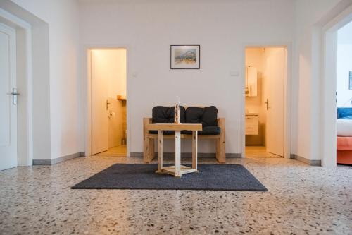 a living room with a table and a couch at Ferienwohnung Engel in Laa an der Thaya