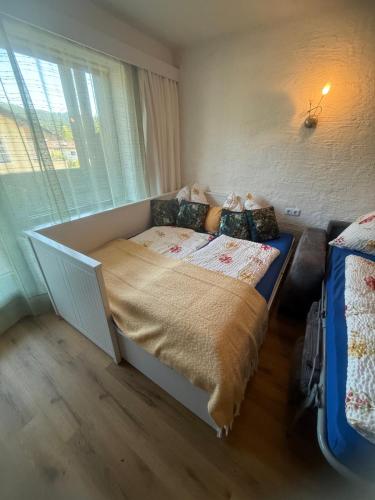 a bedroom with a bed and a window at Andys Enzian in Leutasch