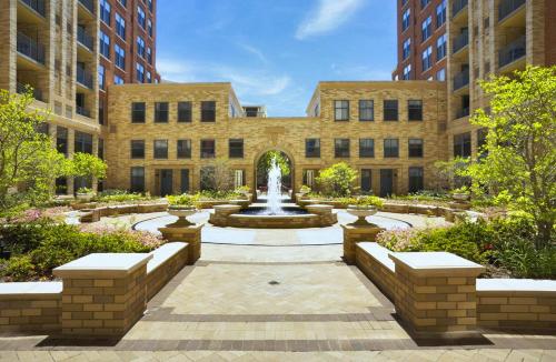 a courtyard with a fountain in front of a building at Pentagon City Comfort Modern Stay in Arlington