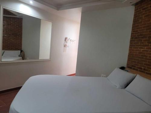 Ein Bett oder Betten in einem Zimmer der Unterkunft Vem Para o - COQUEIROS