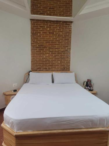 Ein Bett oder Betten in einem Zimmer der Unterkunft Vem Para o - COQUEIROS