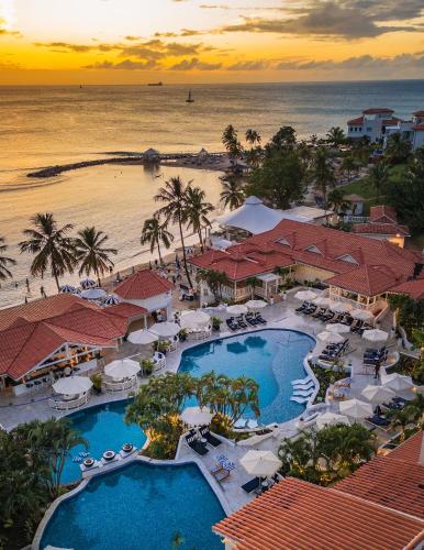 an aerial view of a resort with a pool and the ocean at Windjammer Landing Resort and Residences in Gros Islet