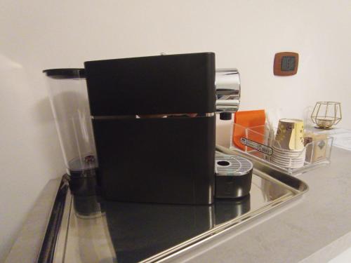 a coffee maker sitting on top of a kitchen counter at Regency House Accoglienza in Portici