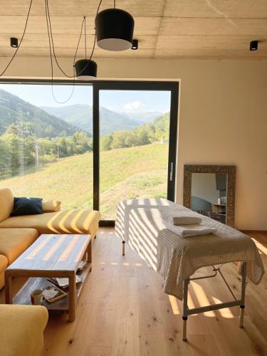 a living room with a couch and a table at Elements Chopok in Bystrá