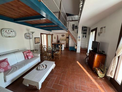 a living room with a couch and a table at Casa del Marinaio in Marina di Carrara