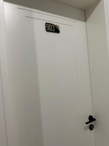 a door with a sign on top of it at Gael Luxury Apartment in Berat