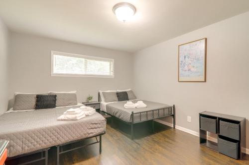a room with two beds and a desk in it at 1 Mi to Dtwn and UGA Condo with Pool in Athens! in Athens