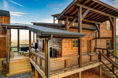 a log cabin with a roof on a deck at Big Sky - Best Views in Blue Ridge in Epworth