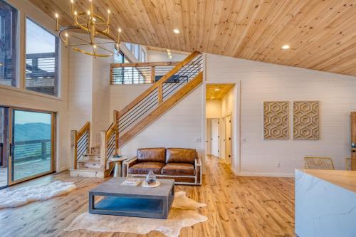 a living room with a couch and a staircase at Big Sky - Best Views in Blue Ridge in Epworth