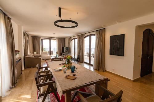 a living room with a wooden table and chairs at Zorka in Budva