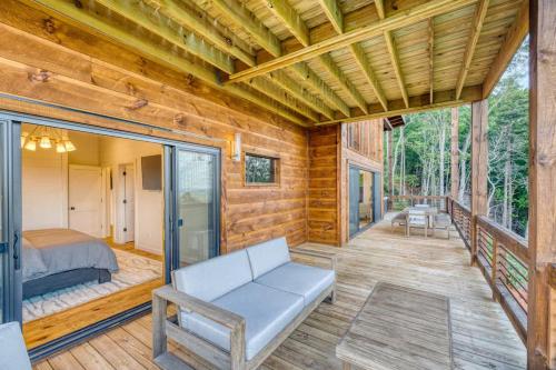 a room with a bed and a couch on a deck at Big Sky - Best Views in Blue Ridge in Epworth
