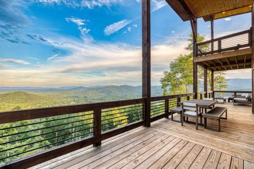 a deck with benches and tables on top of a mountain at Big Sky - Best Views in Blue Ridge in Epworth