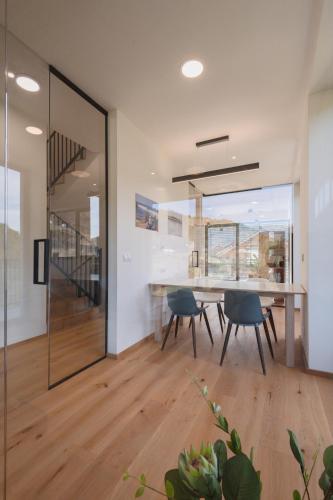 a dining room with a table and chairs at Elements Chopok in Bystrá