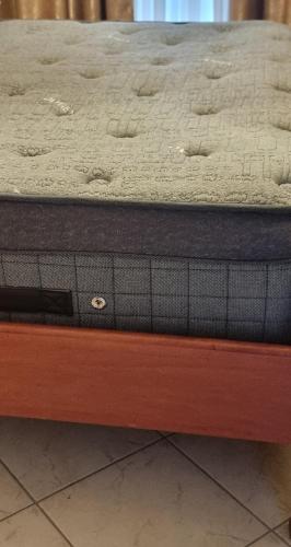a mattress sitting on top of a wooden bench at Pantelia LuxMax Experience in Loutraki