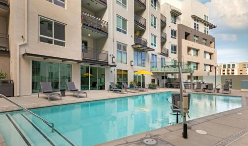 an image of a swimming pool in a apartment building at Mid Century With Pool GYM and Parking 10min to Cedars in Los Angeles