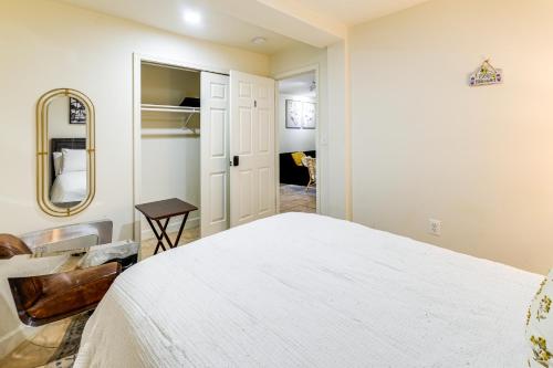 a bedroom with a white bed and a mirror at half Mi to Metrobus Stop! Walkable Petworth Duplex in Washington