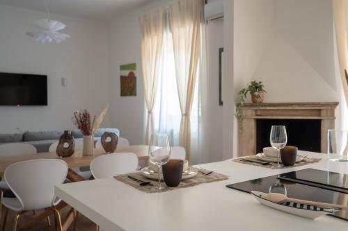a living room with a table with wine glasses on it at LUXURY - Casa dell'artista in Grottammare