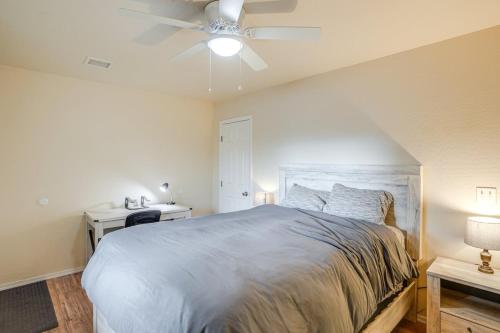 a bedroom with a bed and a ceiling fan at Walk to Downtown Prescott with Fenced Yard! in Prescott
