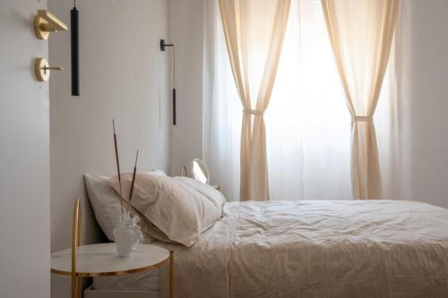 a bedroom with a bed and a window at LUXURY - Casa dell'artista in Grottammare